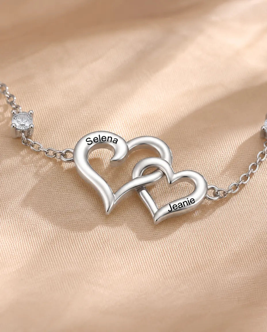 Close-up of the two interlocking hearts with a name engraved on each