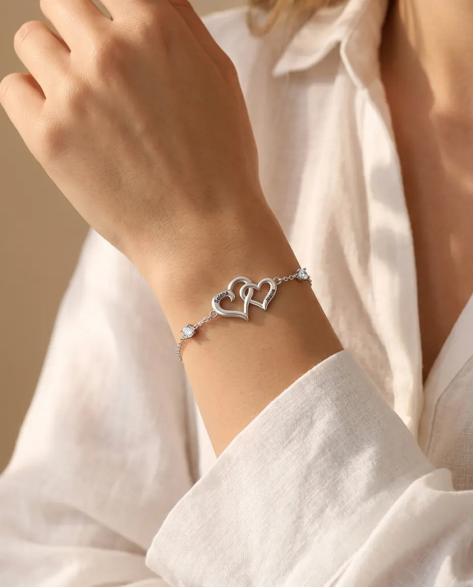 Personalized double heart bracelet worn with a denim jacket