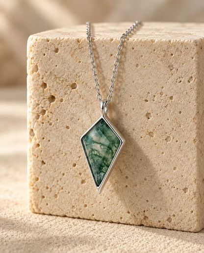 Moss Agate Jewelry Set - displayed on a travertine block