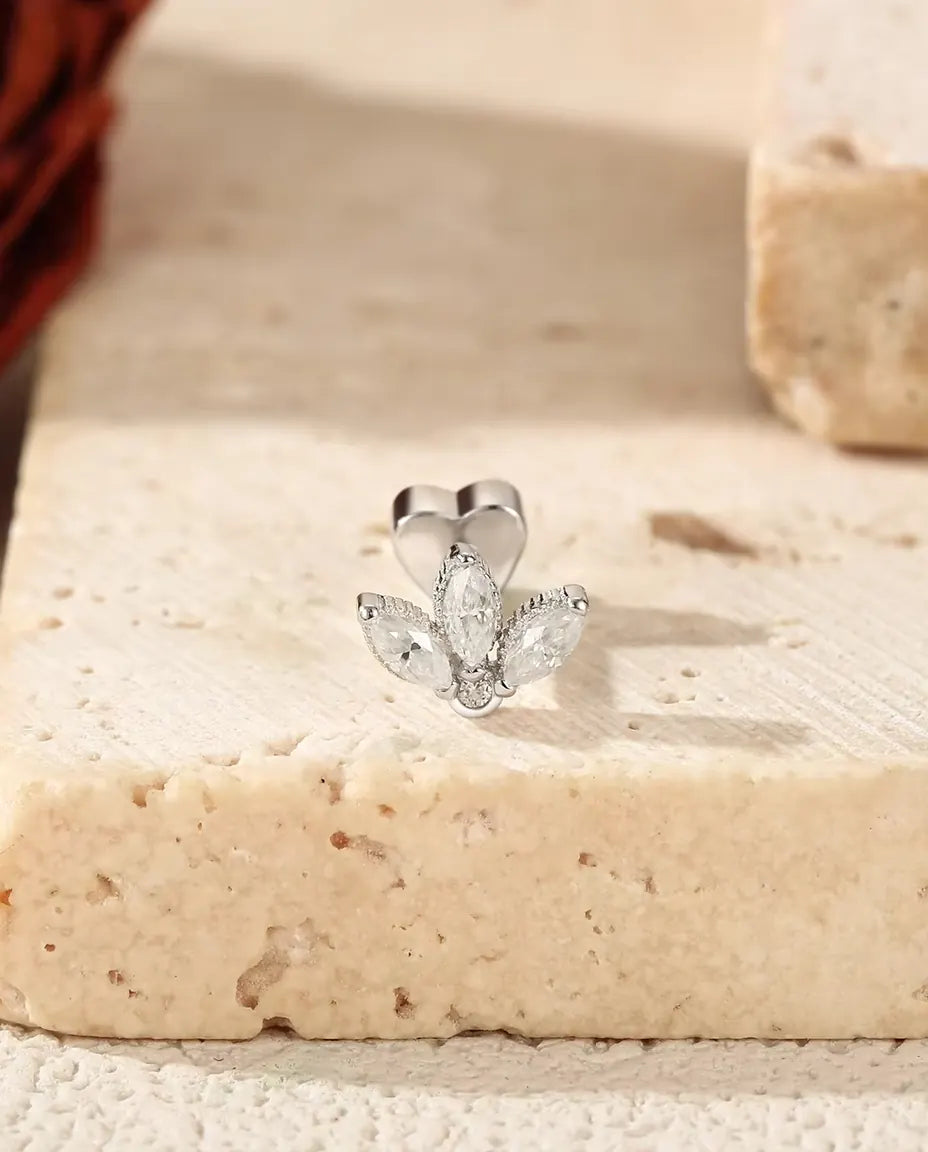 Marquise Moissanite Lotus Stud Earrings in 925 Sterling Silver - standing on the edge of a travertine slab