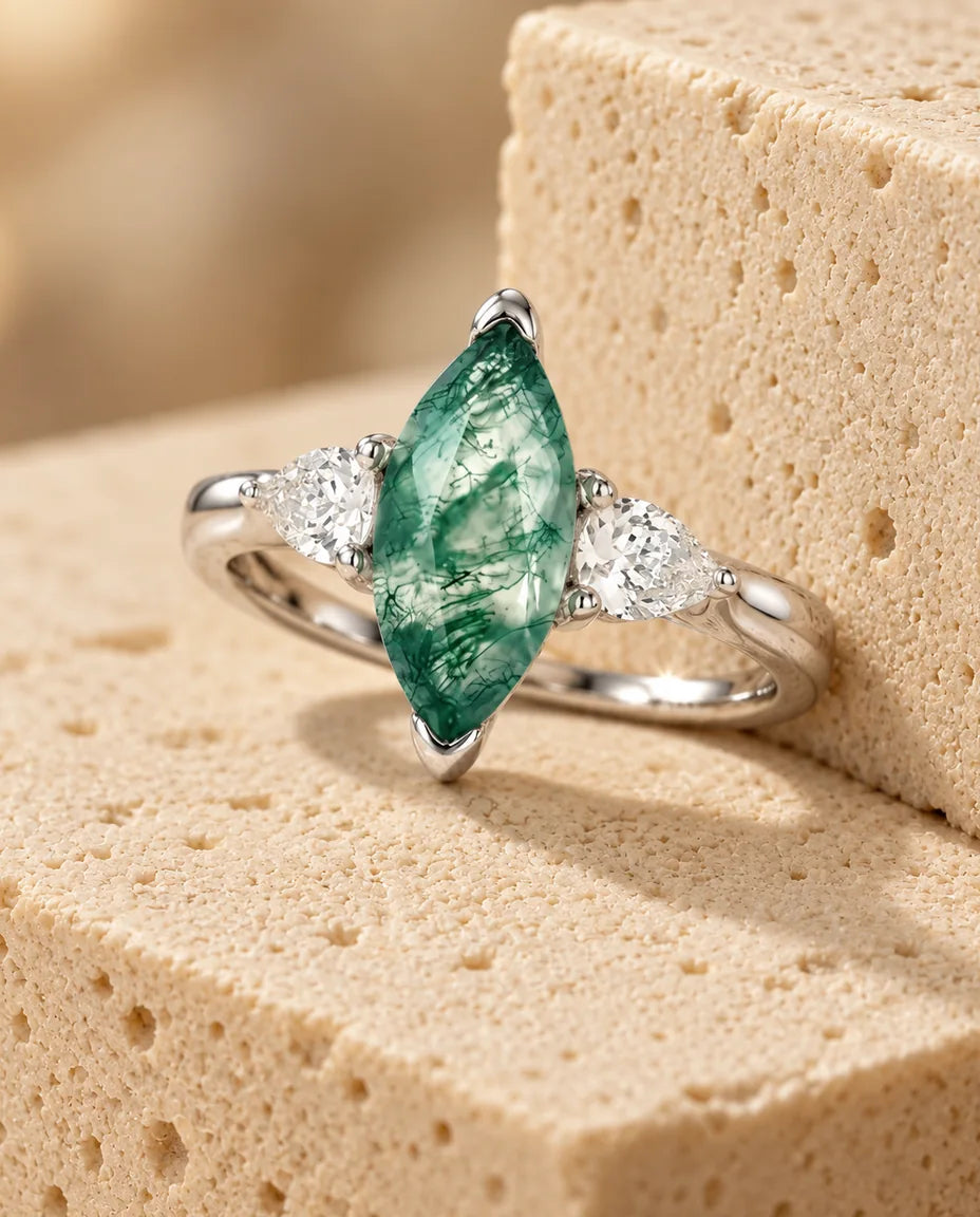Moss Agate Ring - displayed on a travertine block