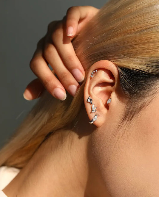 Curved Moissanite Climber Stud Earrings in 925 Sterling Silver - worn in the ear, close-up