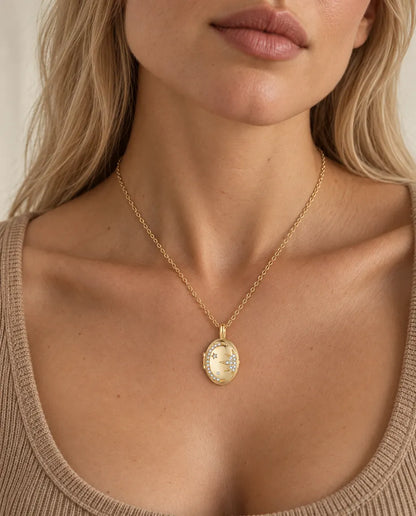 Personalized Moon & Star Oval Photo Locket Necklace That Holds 2 Pictures worn on a model