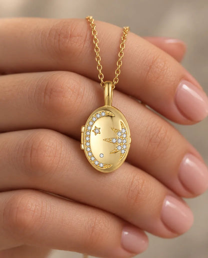 Personalized Moon & Star Oval Photo Locket Necklace That Holds 2 Pictures held in hand