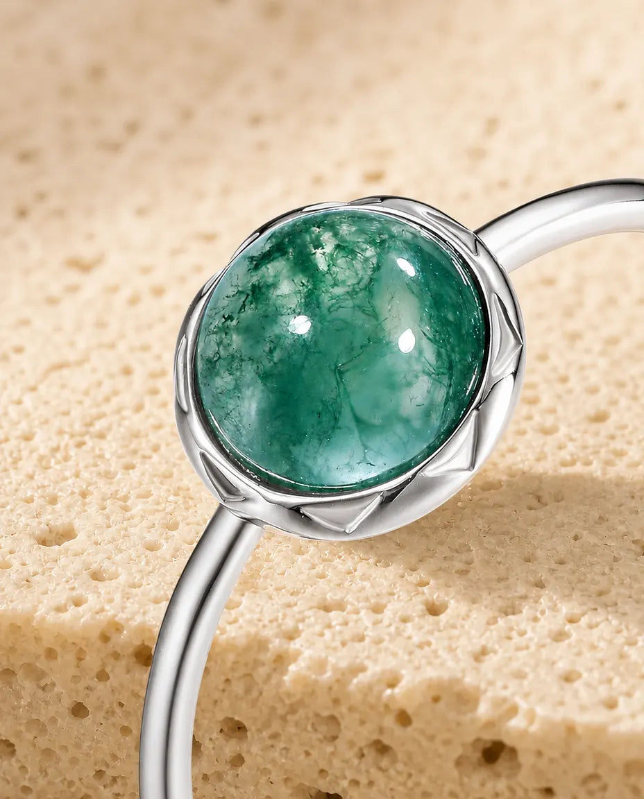 Moss agate round cabochon adjustable ring in sterling silver with sunburst bezel and thin dainty band
