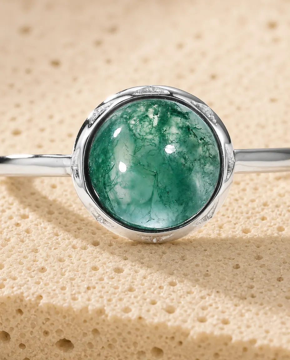 Moss agate round cabochon adjustable ring in sterling silver with sunburst bezel and thin dainty band
