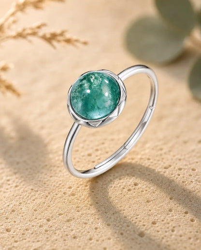Moss agate round cabochon adjustable ring in sterling silver with sunburst bezel and thin dainty band