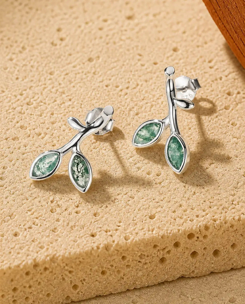 Two marquise moss agate leaves on a silver sprout stud earrings