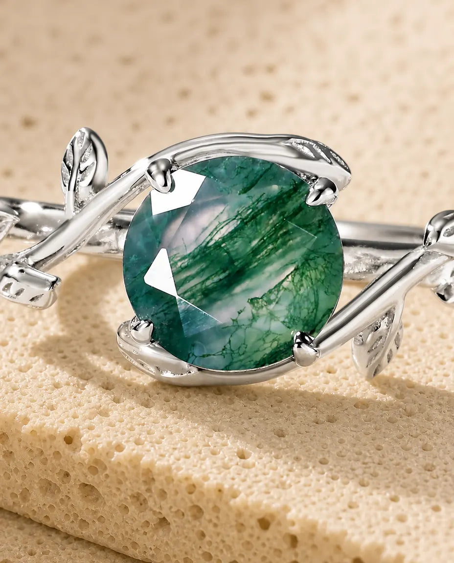 Moss agate vine leaf adjustable ring in sterling silver with round rose-cut stone and sculpted leaf band