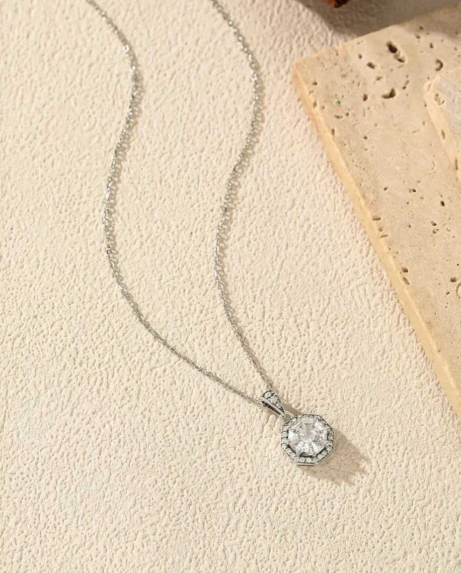 Octagon halo pendant necklace in 925 sterling silver with a step cut clear stone