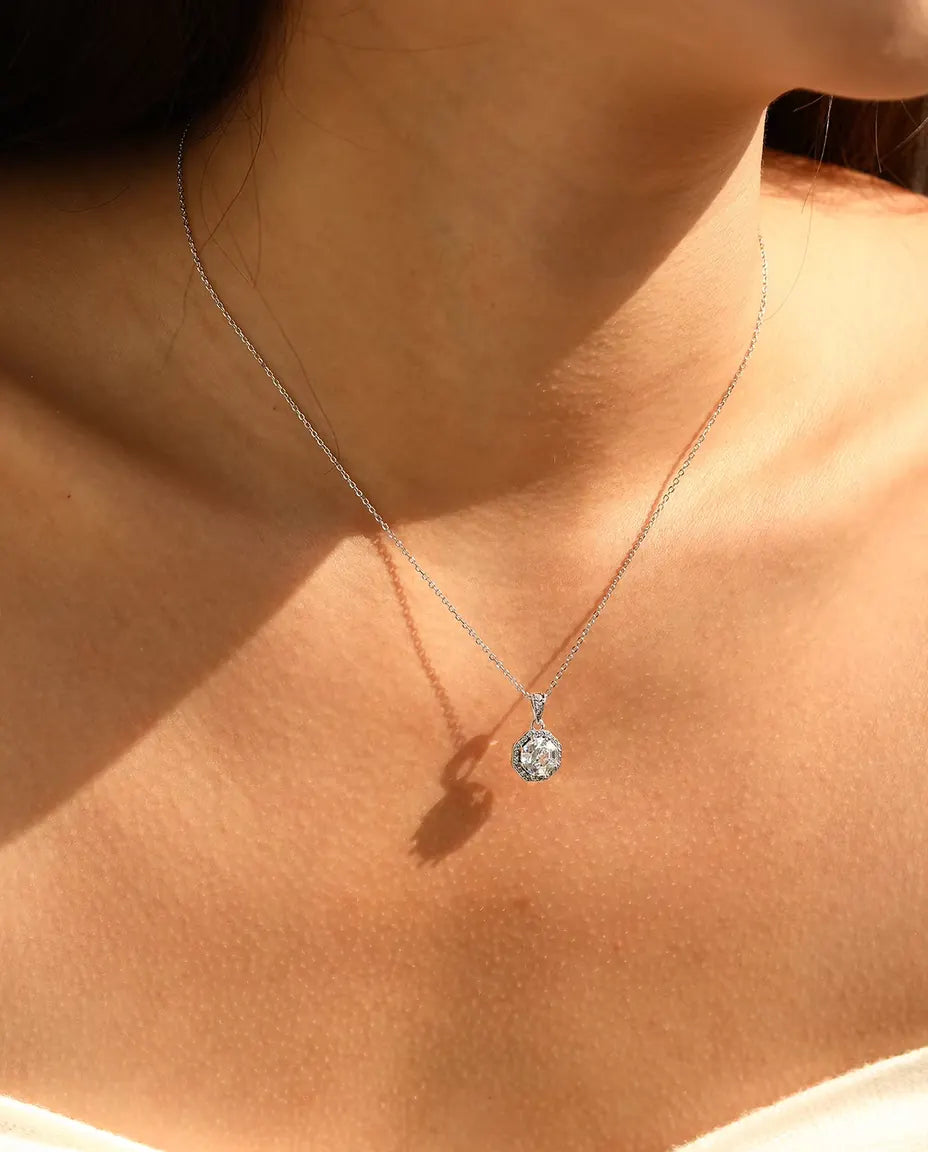 Octagon halo pendant necklace in 925 sterling silver with a step cut clear stone