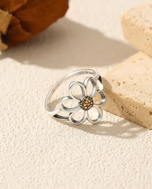 Open flower ring with orange zirconia center in 925 silver