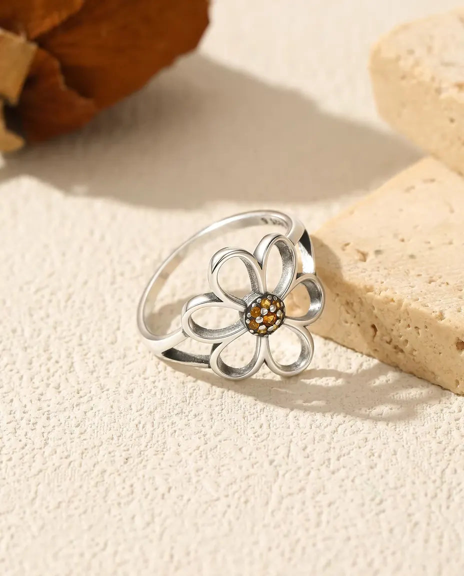 Open flower ring with orange zirconia center in 925 silver
