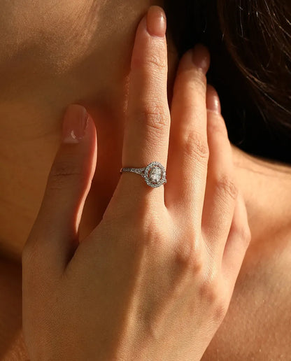 Oval halo moissanite engagement ring in 925 sterling silver