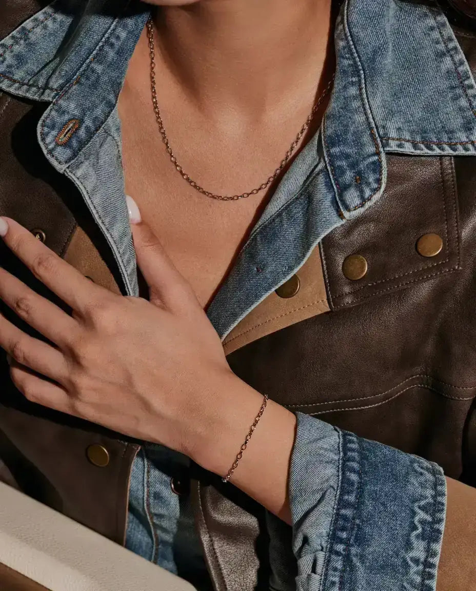 Oval Link Chain Bracelet in 925 Sterling Silver - worn on the wrist, hand resting on the chest