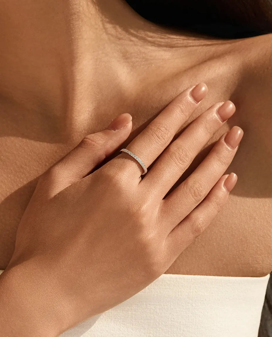 Pavé moissanite wedding band in 925 sterling silver with round D color stones