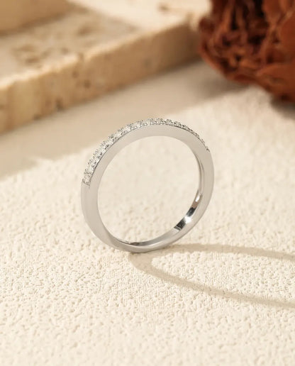 Pavé moissanite wedding band in 925 sterling silver with round D color stones