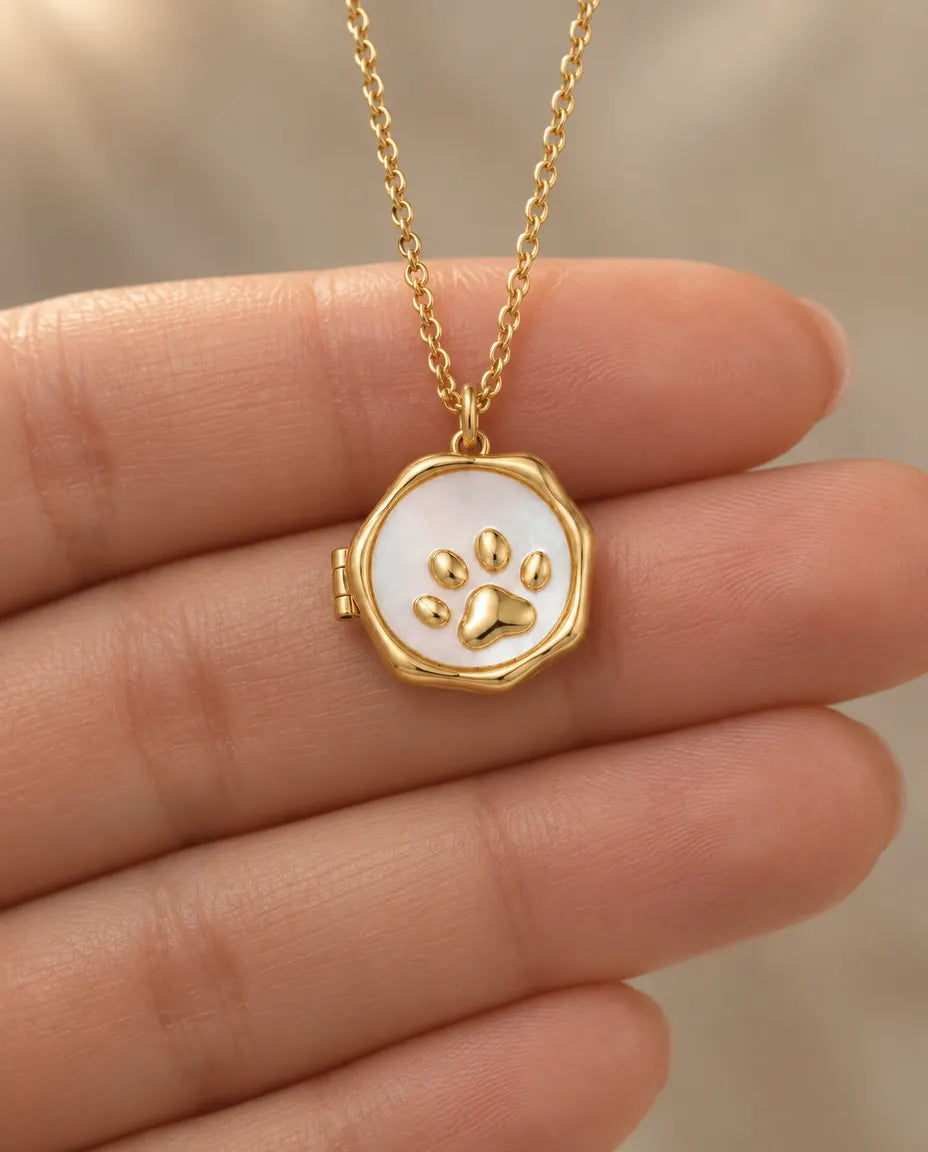 Personalized Paw Print Photo Locket Necklace That Holds 2 Pictures held in hand