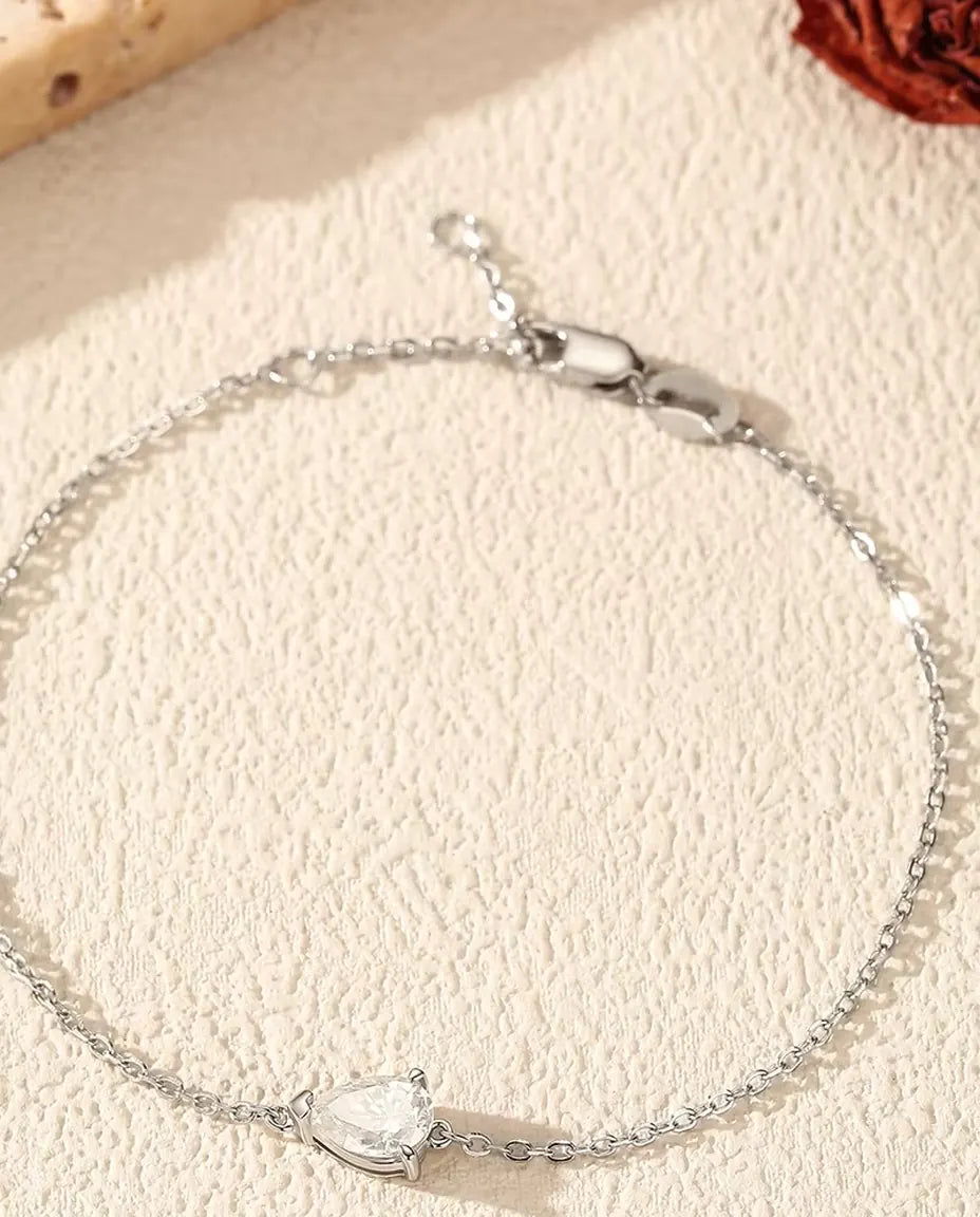 Pear cut moissanite bracelet in 925 sterling silver on a dainty chain