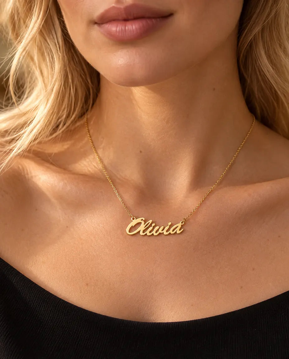 Personalized Brush Script Name Necklace in 925 Sterling Silver - Custom Nameplate - worn on a model in gold