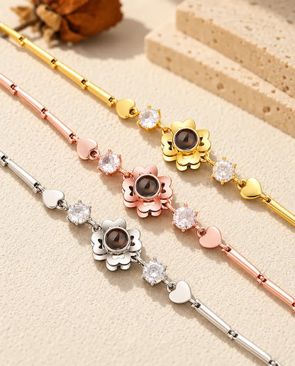 Close-up of three clover flower charms with heart petals in each color