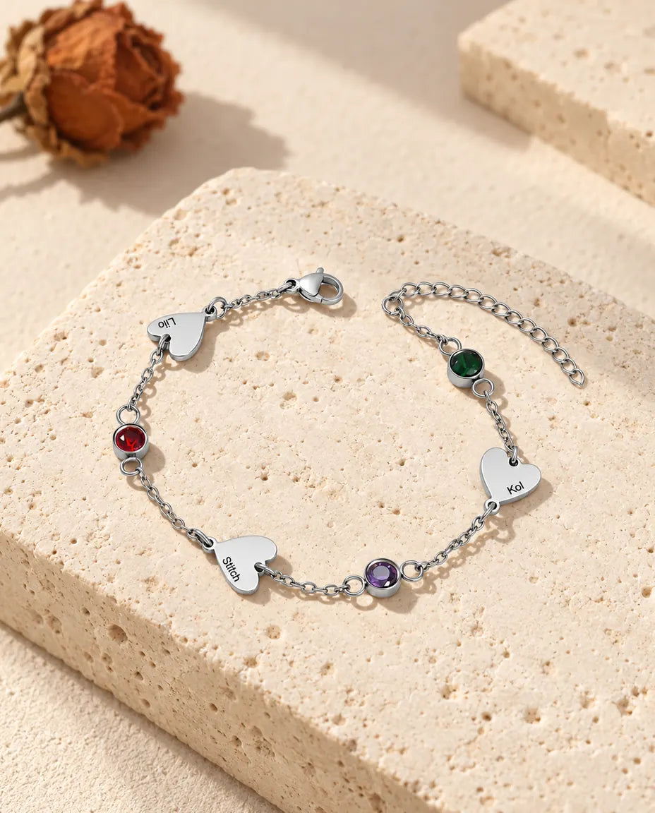 Personalized heart name bracelet with three engraved hearts and three birthstones in stainless steel