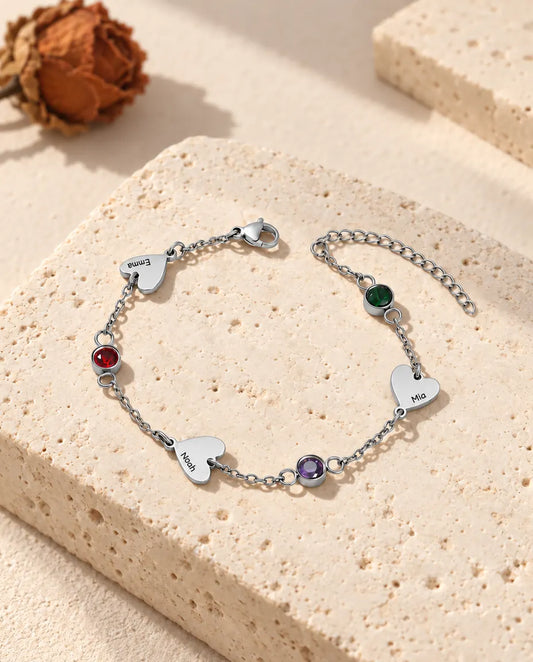Personalized heart name bracelet with three engraved hearts and three birthstones in stainless steel