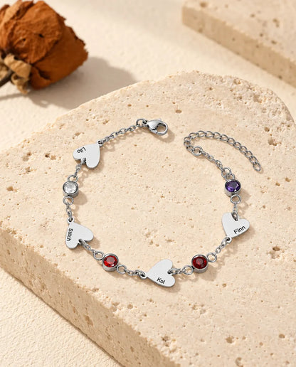 Four-name family bracelet with four engraved hearts and four birthstones