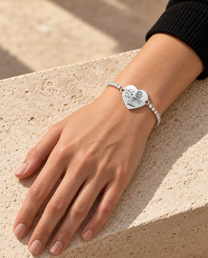Woman wearing the silver tone engraved photo heart bracelet on her wrist