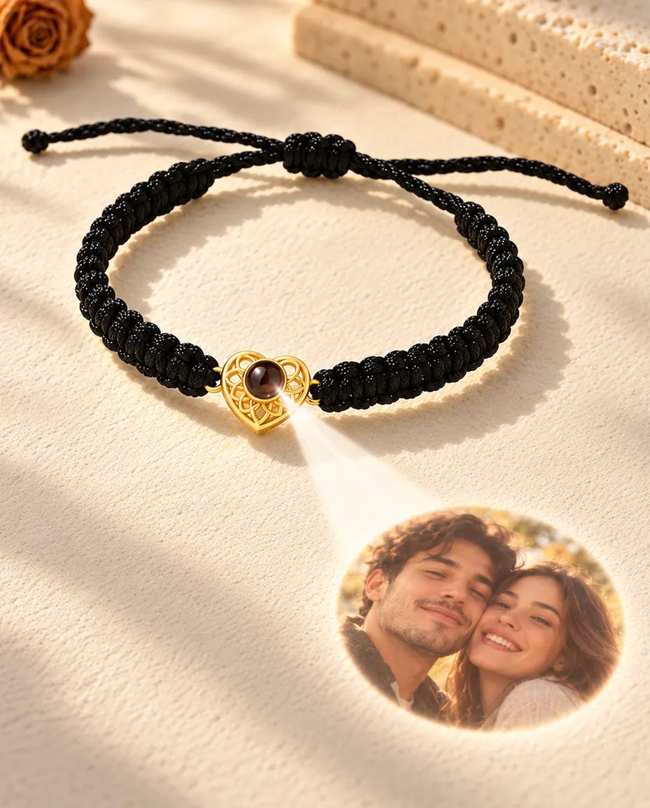 Light through the brown stone of the gold tone heart charm projects a round photo onto the plaster