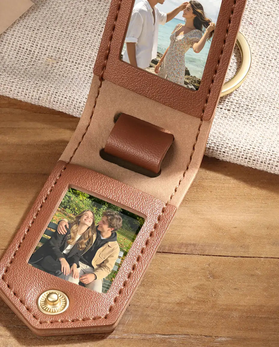 Close-up of brown faux leather photo keychain showing two photo frames and stitching
