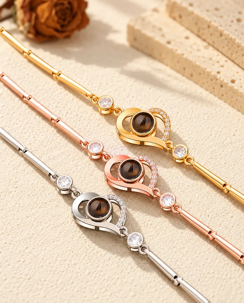 Close-up of three open heart charms with pave stones in each color