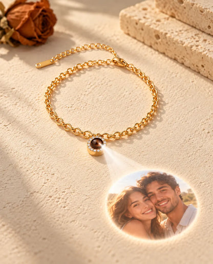 Light through the brown stone of the gold tone pave circle bracelet projects a round photo onto the plaster