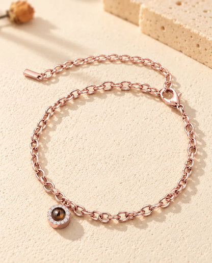 Rose gold tone pave circle photo projection bracelet with lobster clasp and extender