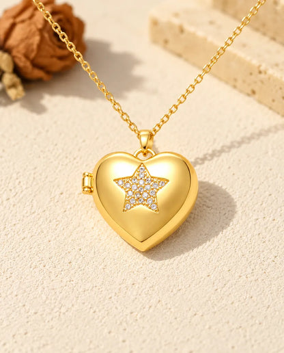 Front view of the gold tone pave star heart photo locket showing the lid design and side hinge