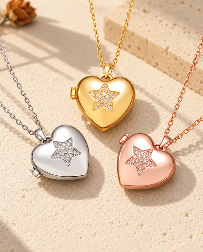 Three colors of the pave star heart photo locket necklace arranged on plaster
