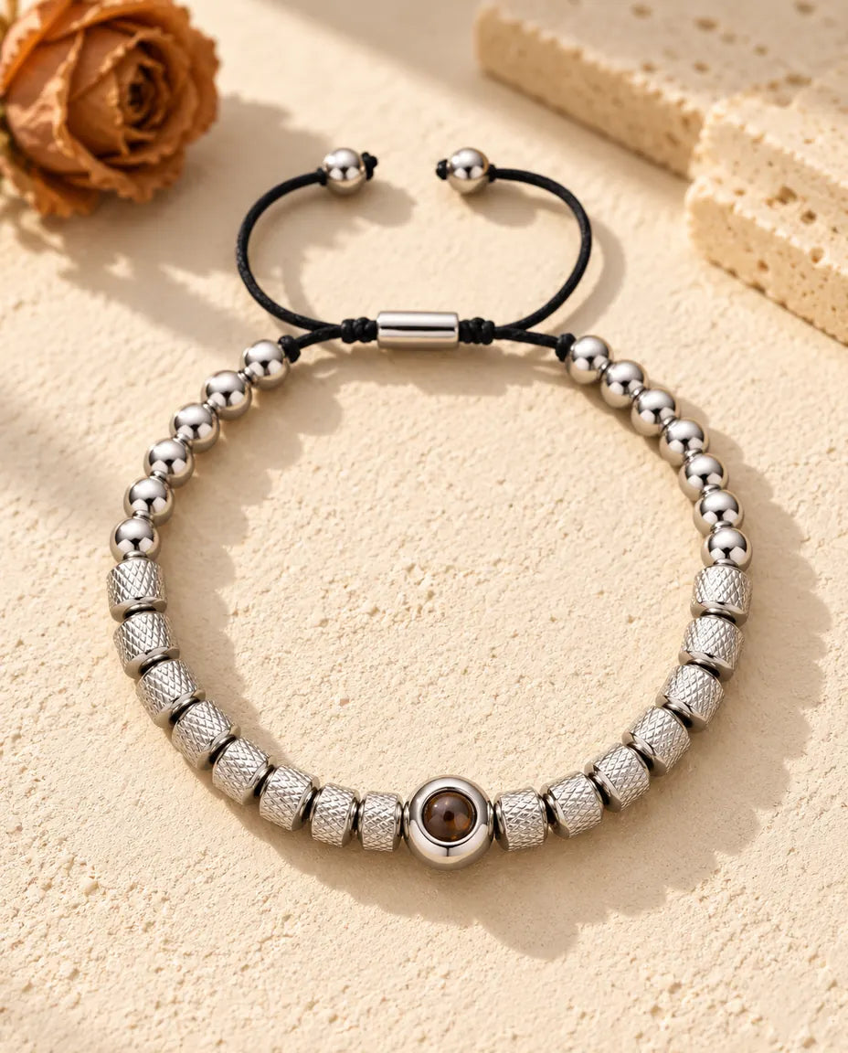 Silver tone textured bead bracelet with a round projection bead