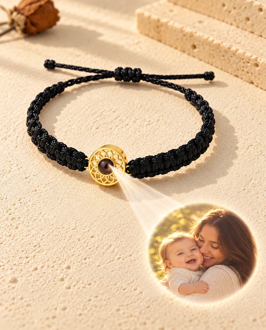 Light through the brown stone of the gold tone round charm projects a round photo onto the plaster