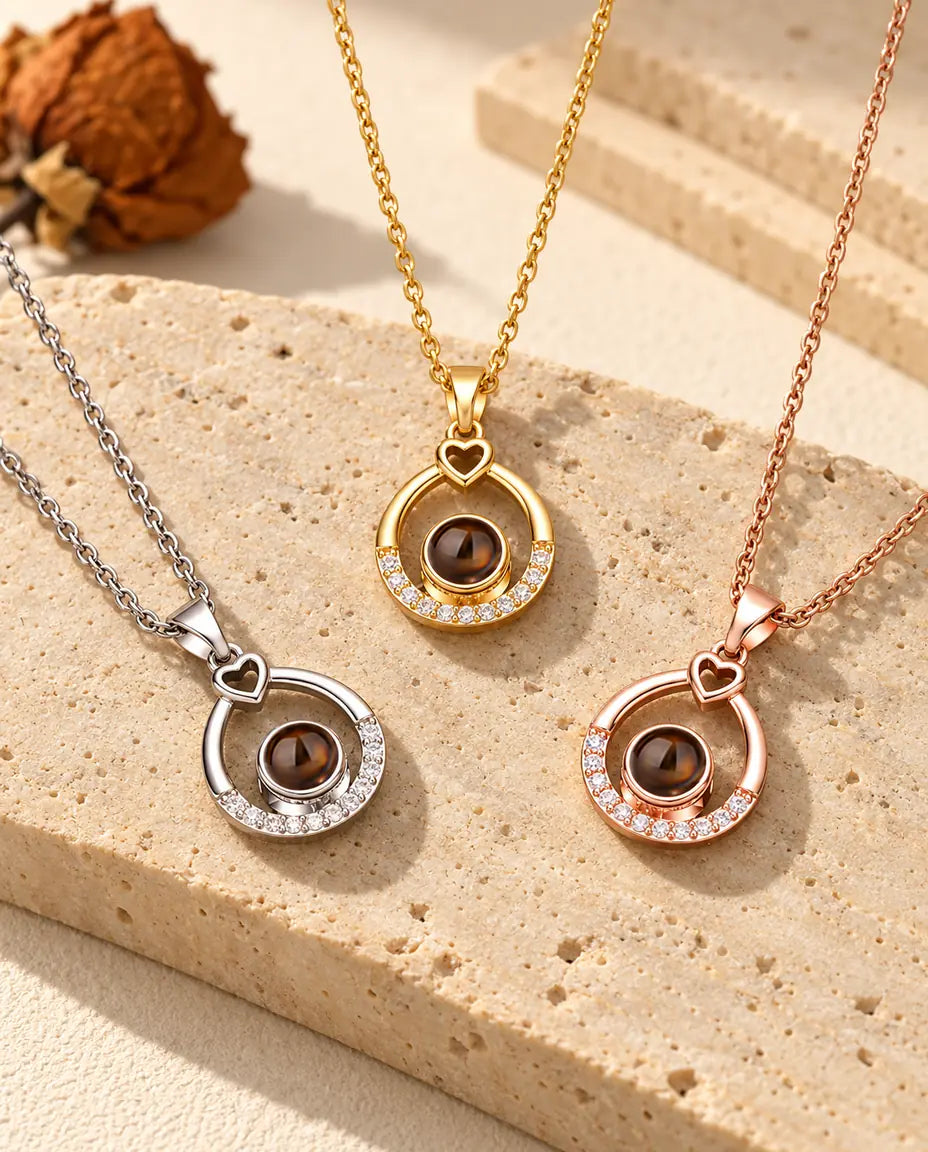 Silver tone, gold tone and rose gold tone teardrop pendants side by side