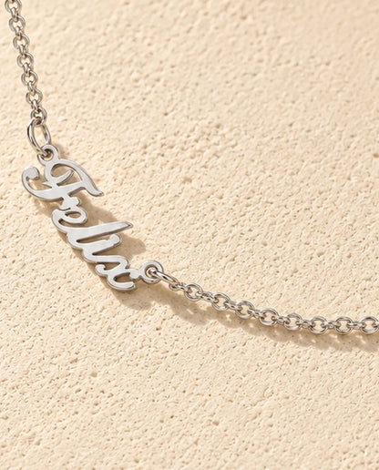 Personalized Two Name Necklace in 925 Sterling Silver - Two Script Nameplates Joined by Chain - close-up of the cut-out name
