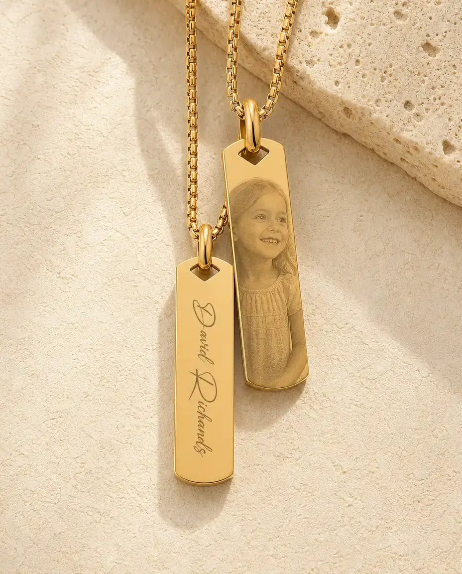 Back of the gold bar engraved with a name, photo-etched front behind it