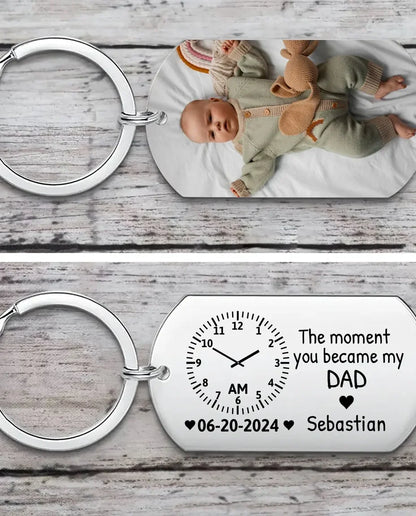 Stainless steel photo keychain with a baby picture printed on the front