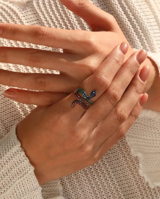 Snake Ring in 925 Sterling Silver with Rainbow Colored Stones - worn on a model’s hand