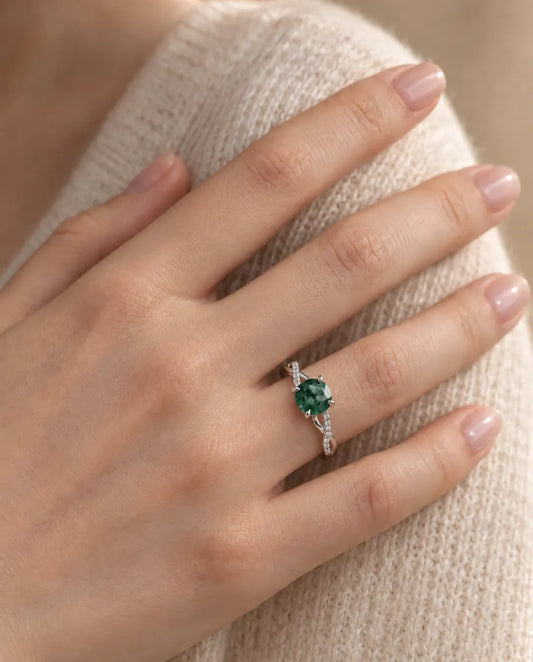 Round Moss Agate Engagement Ring in 925 Sterling Silver - worn on a model’s finger, close-up