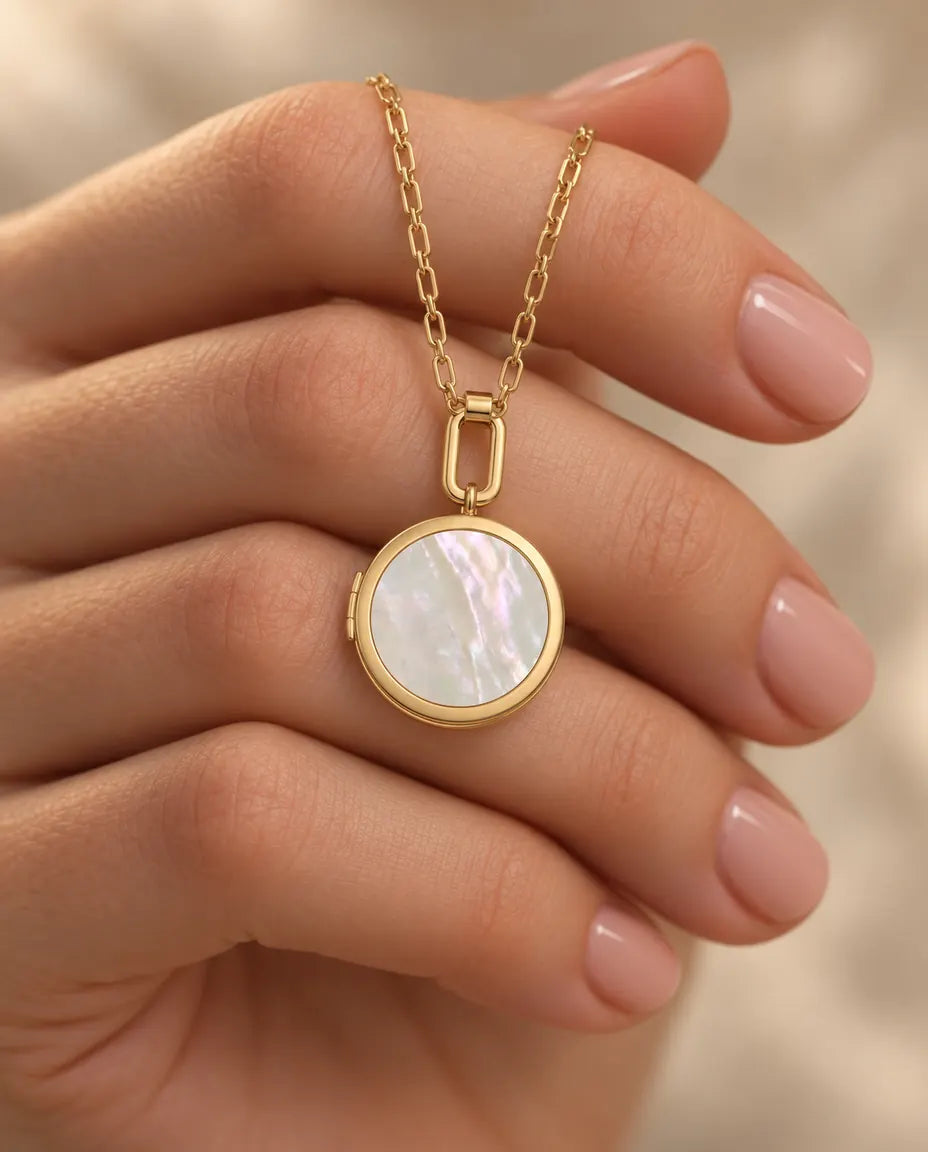 Personalized Round Photo Locket Necklace That Holds 2 Pictures held in hand