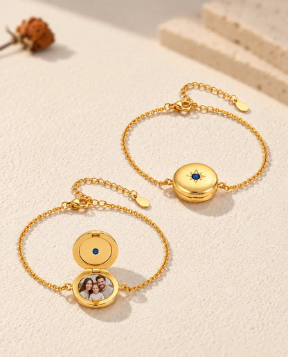 Two round locket bracelets, one closed and one open with a family photo