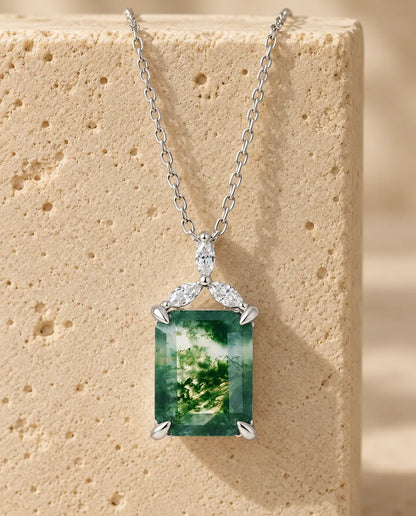 Moss Agate Necklace - displayed on a travertine block