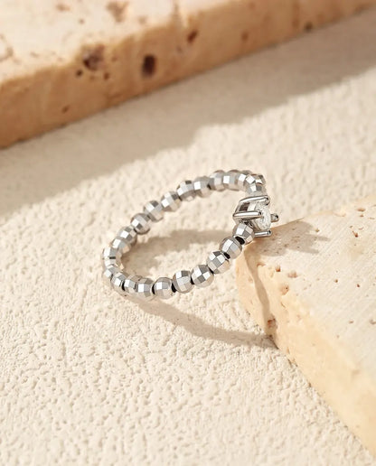 Teardrop moissanite ring on adjustable beaded sterling silver band