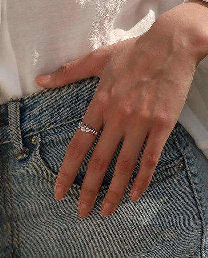 Dangle moissanite ring with three swinging stones on adjustable beaded silver band