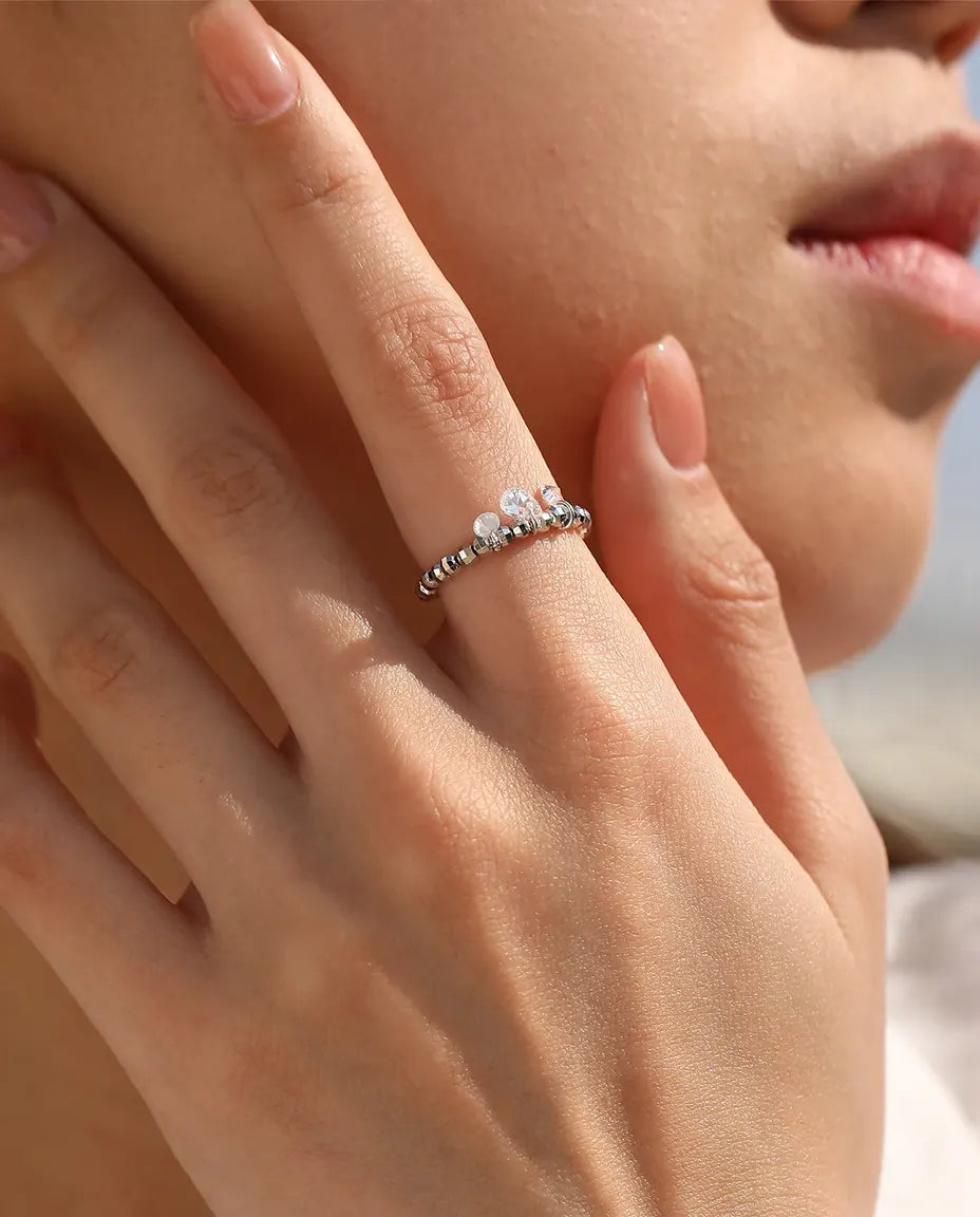 Dangle moissanite ring with three swinging stones on adjustable beaded silver band